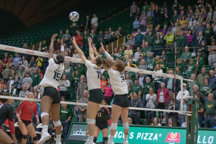 Breana Runnels(#15), Paulina Hougaard-Jensen(#11), and Olivia Nicholson(#3) block a spike from a San Diego State hitter, as Colorado State takes on SDSU at home. CSU sweeps SDSU in three sets. (Devin Cornelius | Collegian)