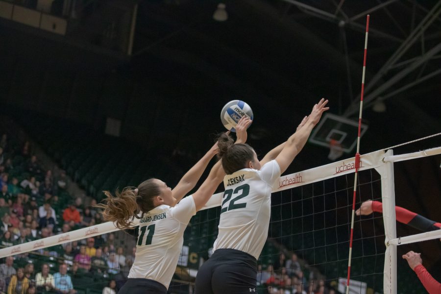 Paulina Hougaard-Jensen(#11) and Katie Oleksak(#22) block an incoming spike, as Colorado State takes on San Diego State at home. CSU sweeps SDSU in three sets. (Devin Cornelius | Collegian)