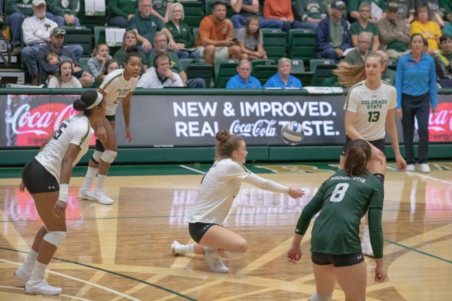 Olivia Nicholson(#3) kneels down to bump the ball to Colorado State's setter, as CSU takes on San Diego State at home. CSU wins three sets to zero. (Devin Cornelius | Collegian)