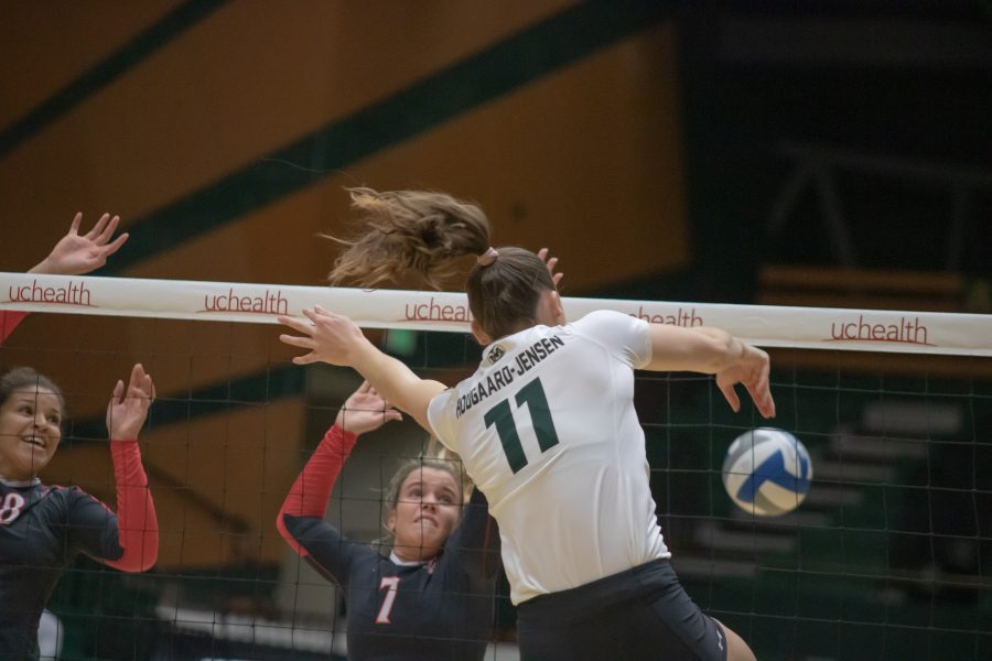 Paulina Hougaard-Jensen(#11) spikes the ball down on the San Diego State side as Colorado State battles SDSU at home. CSU wins three sets to zero. (Devin Cornelius | Collegian)