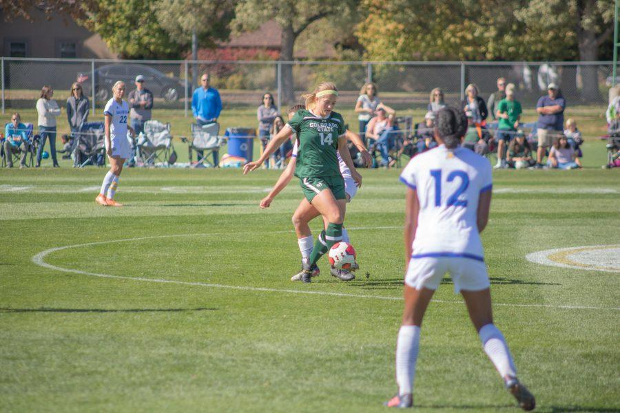 Caeley Lordemann(#14) dribbles the ball around a defender, as Colorado State takes on San Diego State at home. CSU wins two goals to one. (Devin Cornelius | Collegian)