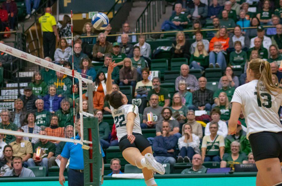 Katie Oleksak(#22) makes an over the head hit to send the ball over to the San Jose State side of the court, during a University home game vs SJSU. CSU wins 3 sets to zero. (Devin Cornelius | Collegian)