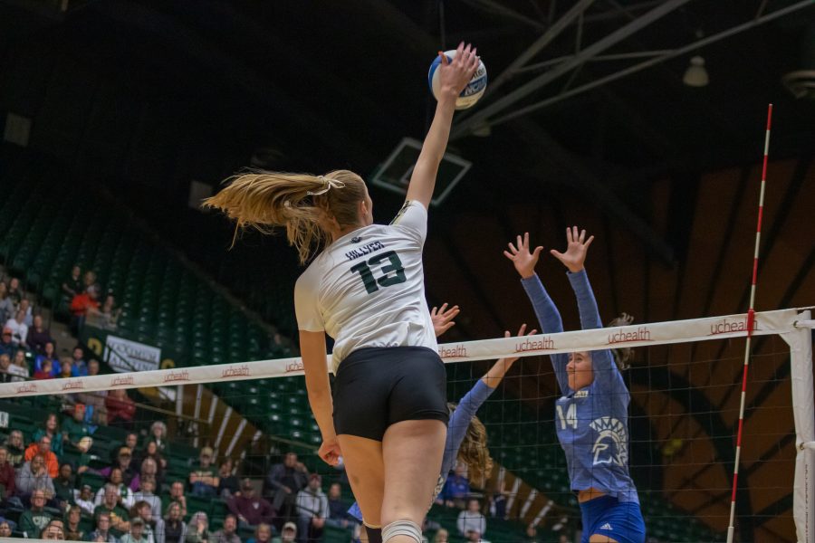 Kirstie Hillyer(#13) spikes the ball down on her opponents, during the University home game against San Jose State. CSU wins three sets to zero. (Devin Cornelius | Collegian)