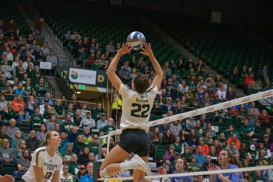 Kirstie Hillyer(#13) prepares to jump as setter Katie Oleksak(#22) sets the ball into the air, during a University home game against San Jose State. CSU wins three sets to zero. (Devin Cornelius | Collegian)