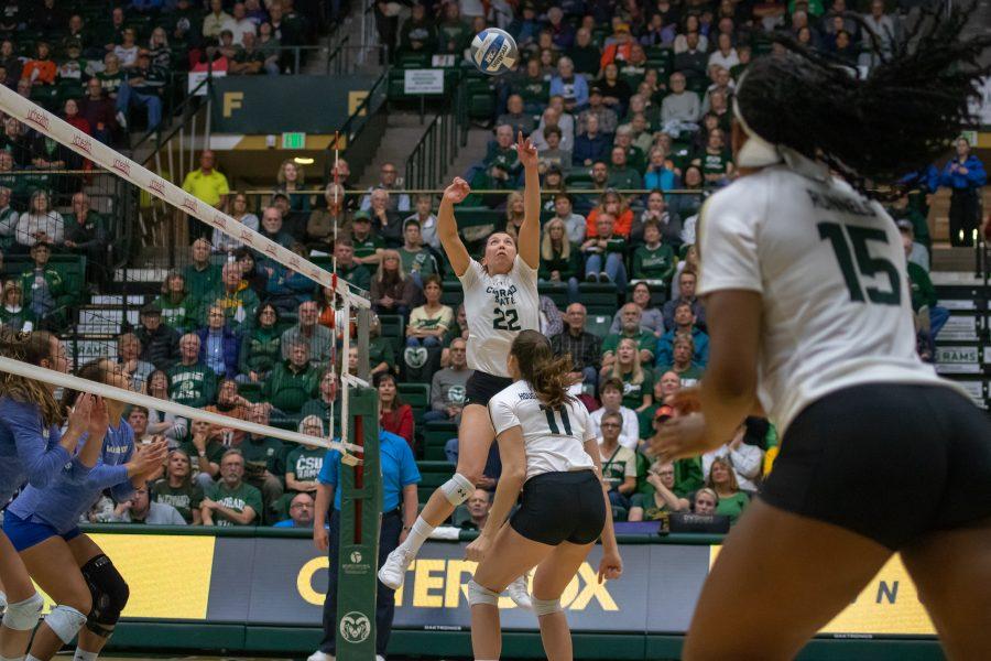 Katie Oleksak(#22) sets the ball up into the air as Breana Runnels(#15) and Paulina Hoggard-Jensen(#11) prepare to spike the ball during the University game against San Diego State. CSU wins three sets to zero. (Devin Cornelius | Collegian)
