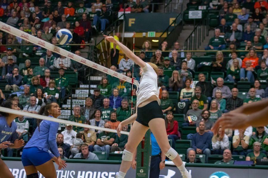 Ciera Zimmerman(#9) spikes the ball down on the San Jose State side of the court, during a University home game. CSU wins three sets to zero. (Devin Cornelius | Collegian)