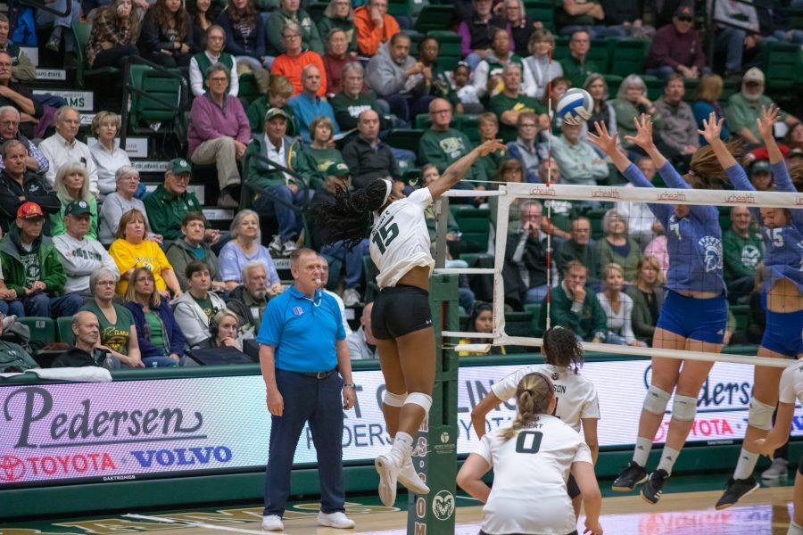 Breana Runnels(#15) spikes the ball towards San Jose State defenders, during the University game against SJSU. CSU wins three sets to zero. (Devin Cornelius | Collegian)