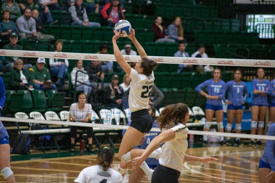 Katie Oleksak(#22) sets the ball to one of her teammates, during a University home game against San Jose State. CSU wins three sets to zero. (Devin Cornelius | Collegian)