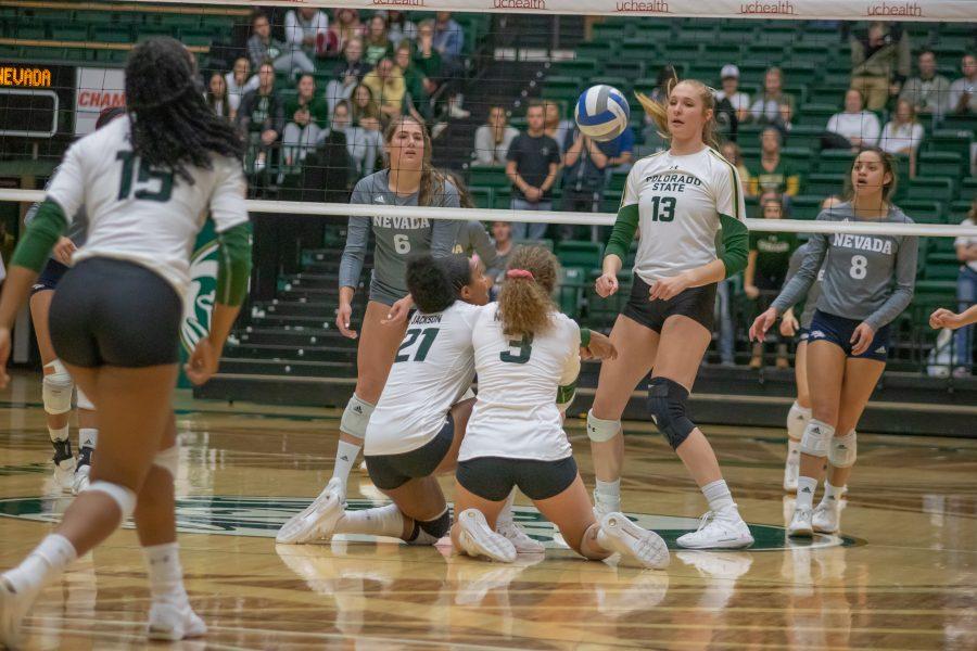 Jessica Jackson(#21) and Olivia Nicholson(#3) slide and bump the ball back up into the air, during the University home game against Nevada. CSU wins three to zero. (Devin Cornelius | Collegian)