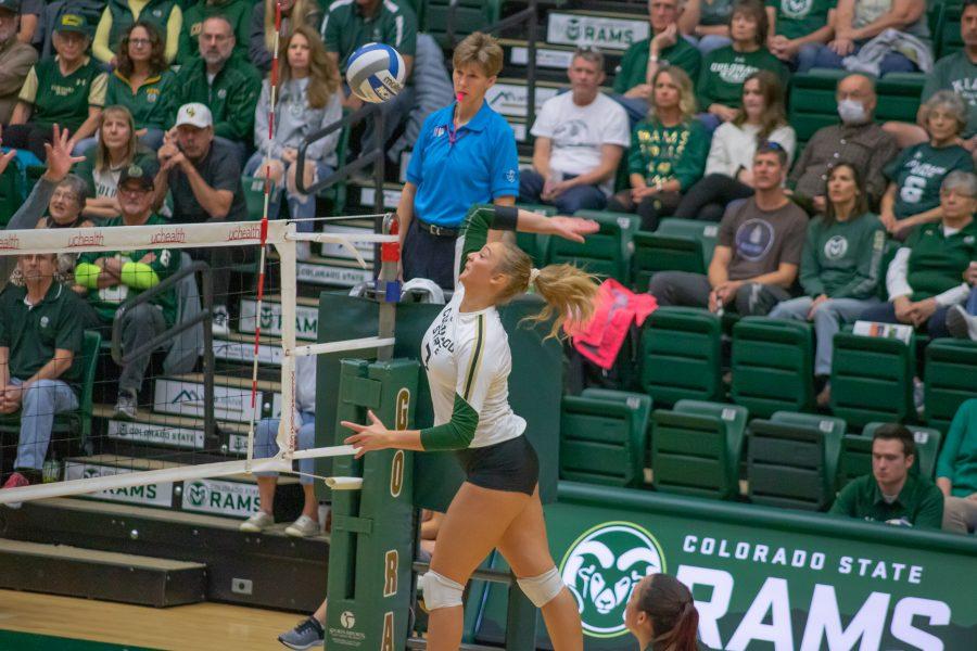 Sasha Colombo(#7) winds back and prepares to hit the ball towards the Opponent's side, as the University takes on Nevada at home. CSU wins three sets to zero. (Devin Cornelius | Collegian)