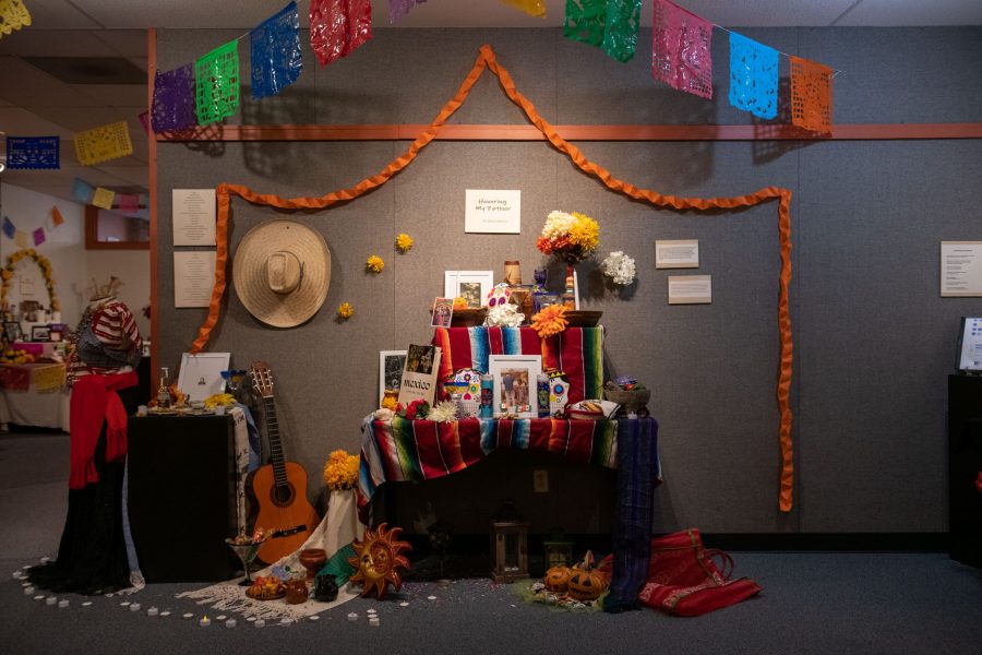 An alter created by Gloria García Díaz titled “Honoring My Father,” is displayed in honor of Day of the Dead at the Global Village Museum Oct. 8. Díaz is a bilingual Mexican writer, essayist, and poet who has lived with her family in Fort Collins, Colorado for over a decade. (Colin Shepherd | The Collegian)