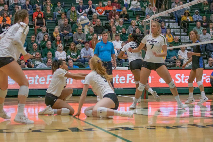 Brooke Hudson (4) and Ciera Zimmerman (9) slide down and save the ball, during the University's home game against Air Force. CSU wins three sets to zero. (Devin Cornelius | Collegian)