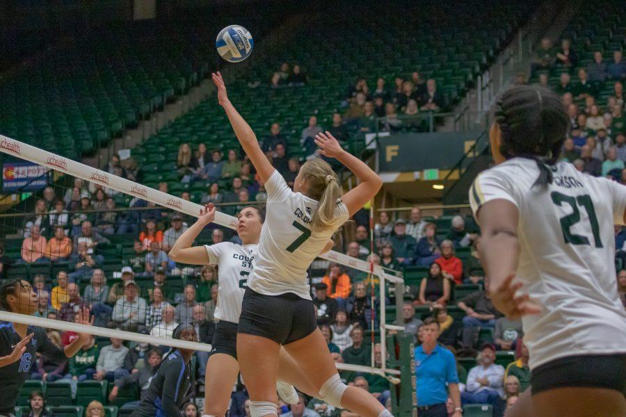 Sasha Colombo (7) spikes the ball down towards the opponent's side, during the University's home game against Air Force. CSU wins three sets to zero. (Devin Cornelius | Collegian)