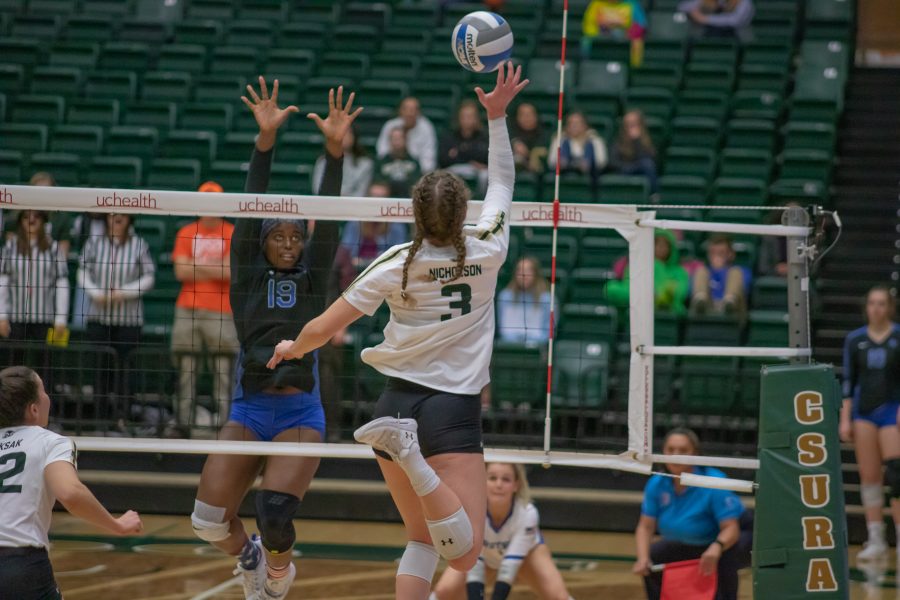Olivia Nicholson (3) tips the ball over the net, during the University home game against Air Force. CSU wins three sets to zero. (Devin Cornelius | Collegian)