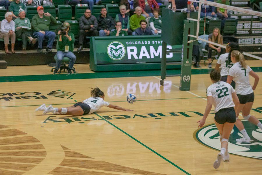 Brooke Hudson (4) attempts a dig to keep the ball from touching the CSU side, during the University's home game against Air Force. CSU wins three sets to zero. (Devin Cornelius | Collegian)