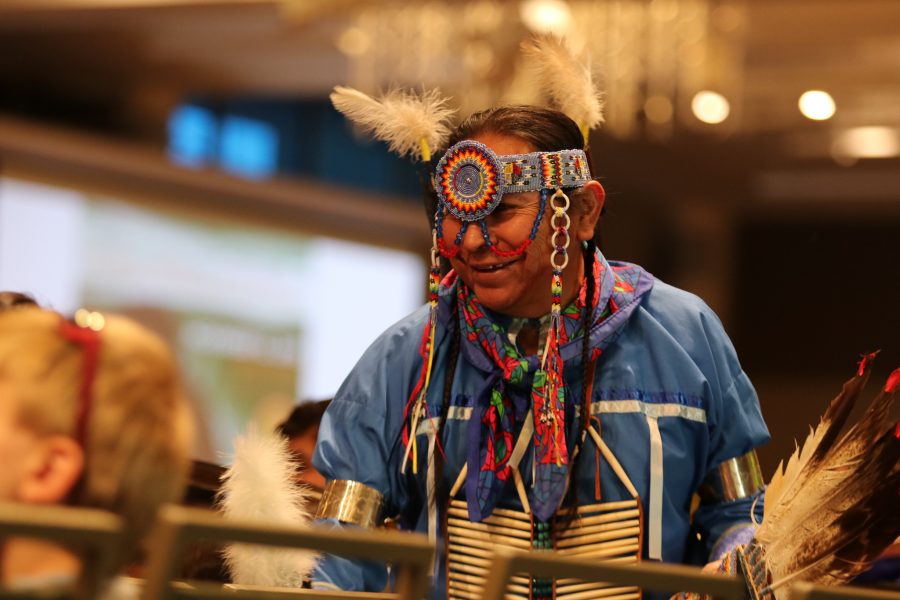 John Gaisthea speaks with audience members at the 37th annual Pow Wow at the Lory Student Center ballroom, Oct. 26. Fort Collins resident Gaisthea has been performing for more than 20 years. (Anna von Pechmann | The Collegian) 