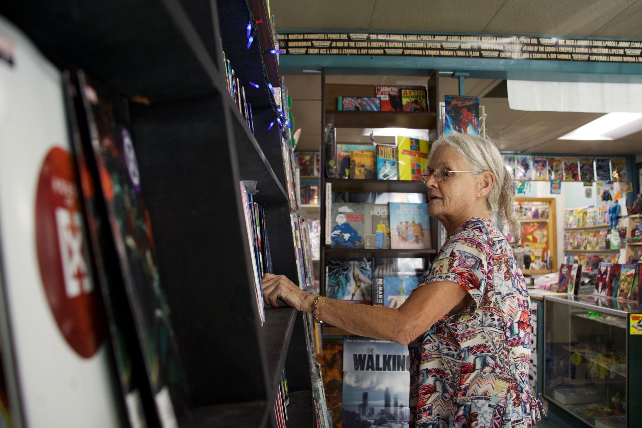 woman works in comic shop