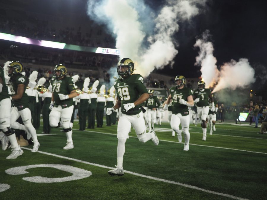 Members of the CSU football team run out of the tunnel before their game against Air Force on Nov. 16. The Rams lost to the Falcons 38-21 after allowign 24 points in the fourth quarter. (Gregory James | The Collegian)
