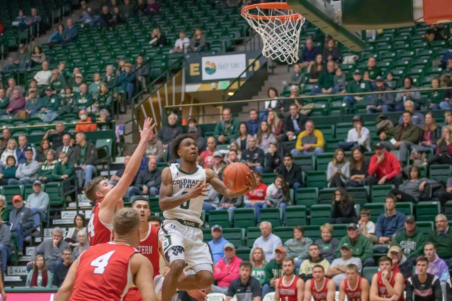 Hyron Edwards (0) drives between defenders and jumps for a layup, as Colorado State takes on Western Colorado University for an exhibition match at home. CSU wins 79-41. (Devin Cornelius | Collegian)