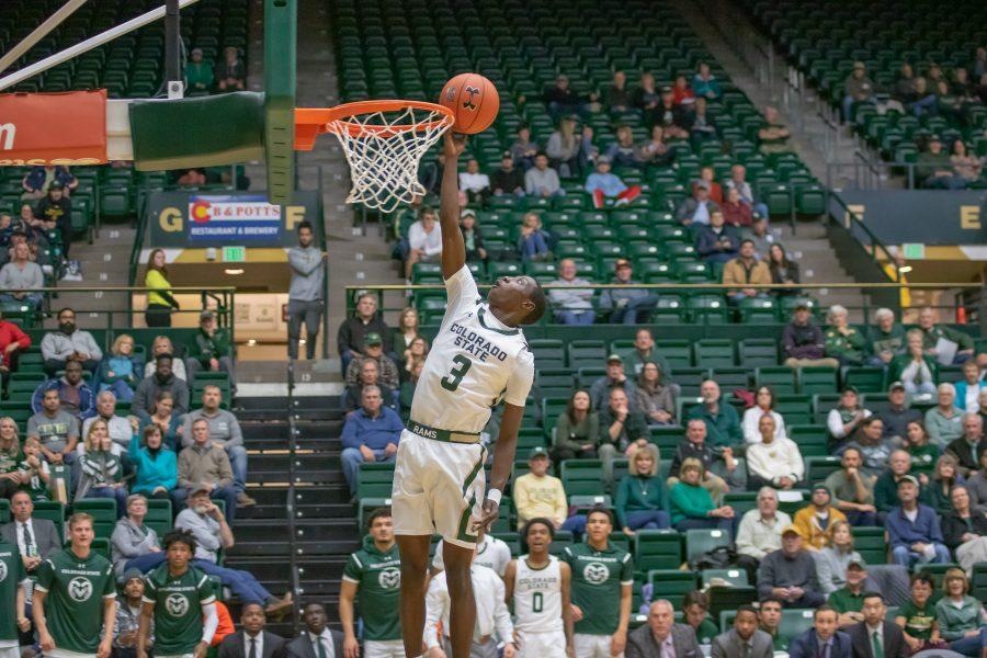 Kendle Moore (3) reaches up for a dunk attempt, during the University's exhibition match against Western Colorado. CSU wins 71- 41. (Devin Cornelius | Collegian)