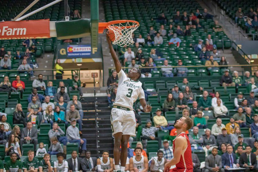 Kendle Moore (3) leaps up and shoots a layup after a fastbreak, during the University exhibition match against Western Colorado. CSU wins 79-41. (Devin Cornelius | Collegian)