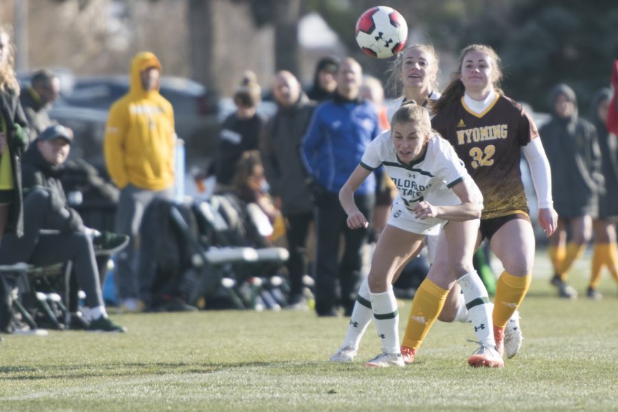 Freshman forward Caroline Lucas heads the ball after a throw-in from a teammate. (Lucy Morantz | Collegian)
