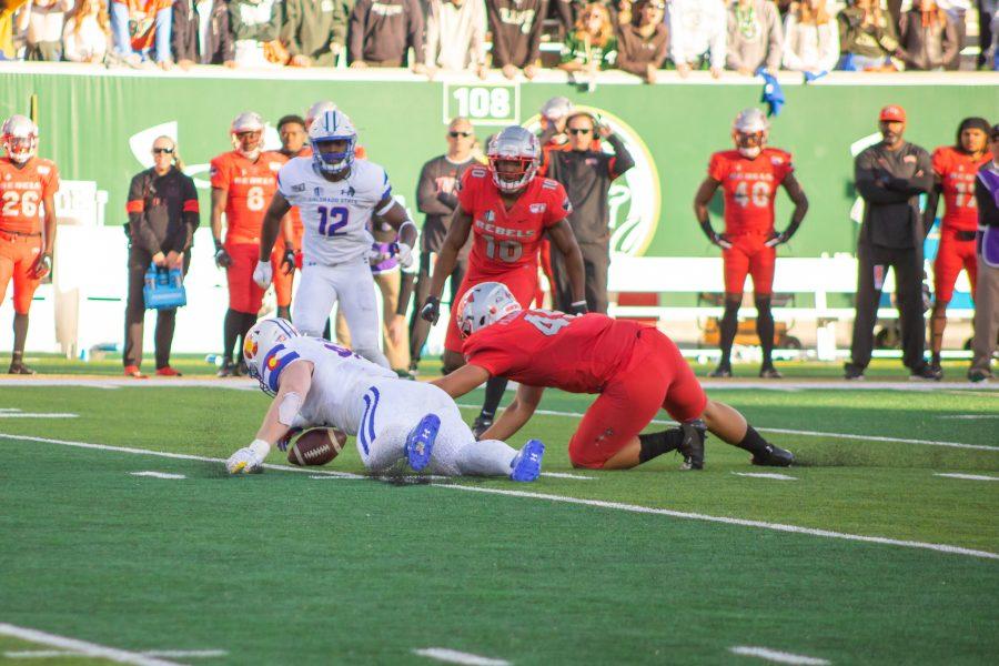 Toby McBride (97) jumps on a loose ball, during the University game against the University of Las Vegas. CSU wins 37-17. (Devin Cornelius | Collegian)