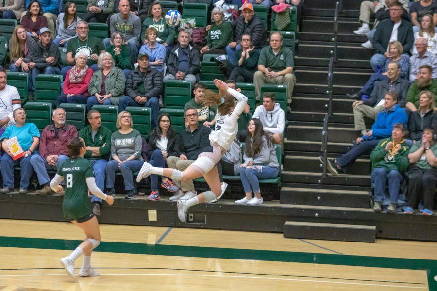 Outside Hitter Olivia Nicholson makes a leaping bump in order to continue the rally, as the University takes on Utah State at home on Nov 14. CSU wins three sets to zero. (Devin Cornelius | Collegian)