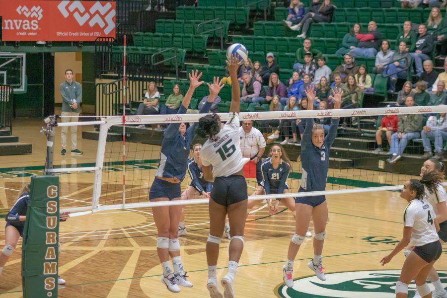 Breana Runnels (15) spikes the ball over the net towards her opponents side, during the Colorado State home game against Utah State on Nov.14. CSU wins three sets to zero. (Devin Cornelius | Collegian)