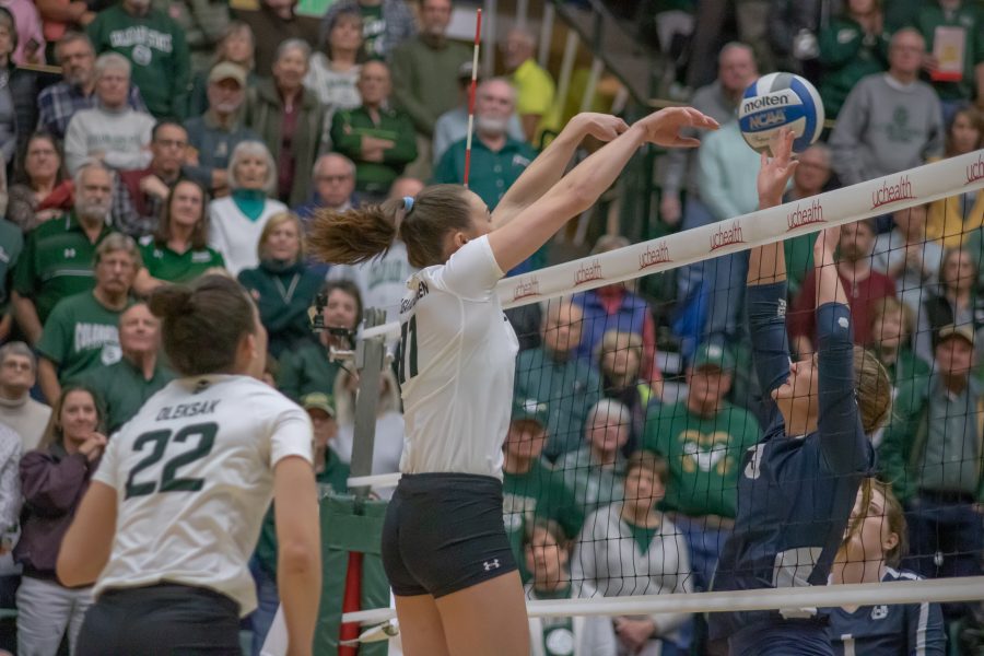 Paulina Hougaard-Jensen (11) pushes the ball over a defender, during the University's match against Utah State at Moby Arena on Nov 14. CSU wins three sets to zero. (Devin Cornelius | Collegian)