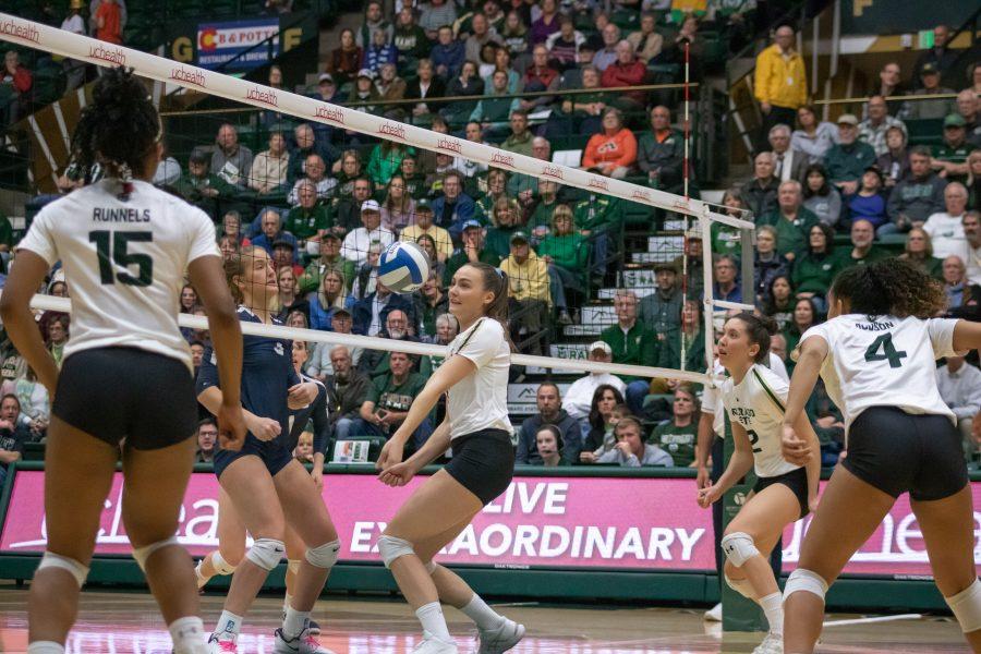 Pauline Hougaard-Jensen (11) bumps the ball into the air, during the University's match against Utah State on Nov. 14 at home, CSU wins three sets to zero. (Devin Cornelius | Collegian)