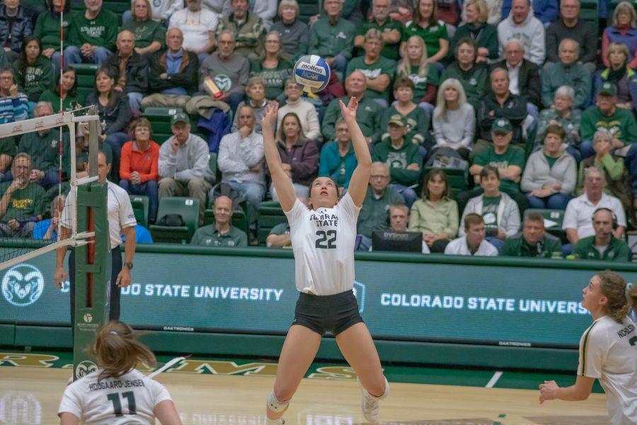 Katie Oleksak (22) leaps up to set the ball to Outside hitter Olivia Nicholson (3), during the University's home game against Utah State on Nov 14. CSU wins three sets to zero. (Devin Cornelius | Collegian)