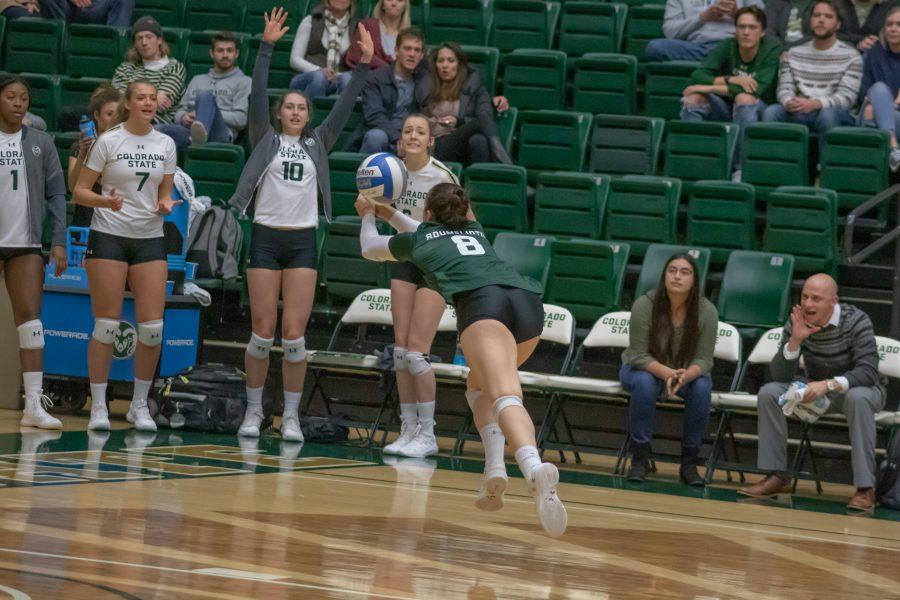 Alexa Roumeliotis (8) runs and reaches out to bump the ball, during the University match against Utah State on Nov 14. CSU wins three sets to zero.(Devin Cornelius | Collegian)