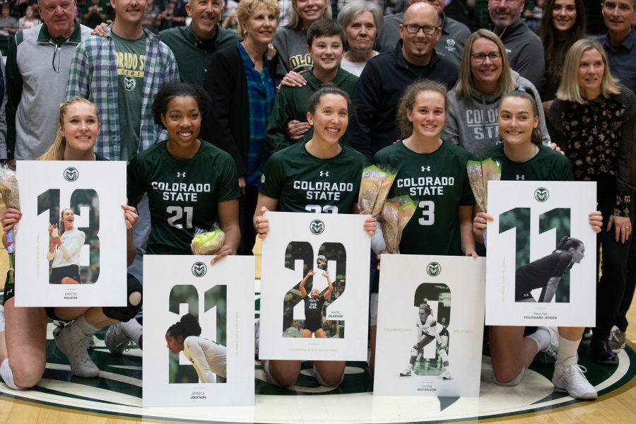 Colorado State Volleyball's 2019 senior class smiles with their families before their match against Boise State on Nov 16. CSU wins three sets to zero. (Devin Cornelius | Collegian)
