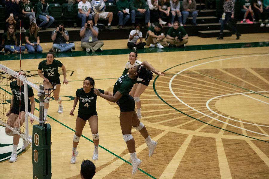 Outside hitter Breana Runnels (15) spikes the ball over a defender during the Colorado State home game against Boise State on Nov. 16, 2019. CSU won three sets to zero. (Devin Cornelius | The Collegian)