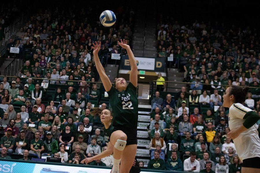 Setteer Katie Oleksak (22) sets the ball to one of her teammates, during the University home game against Boise State at Moby Arena on Nov 16. CSU wins three sets to zero. (Devin Cornelius | Collegian)