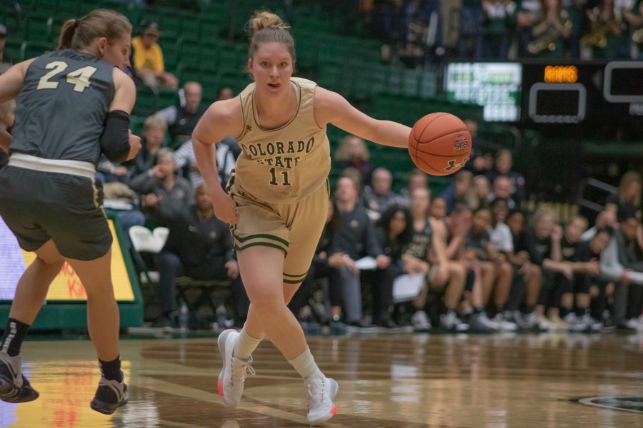 Makenzie Ellis (11) drives past a defender towards the basket, during the University home game vs Colorado University on Nov. 22. CSU loses 79-75. (Devin Cornelius | Collegian)