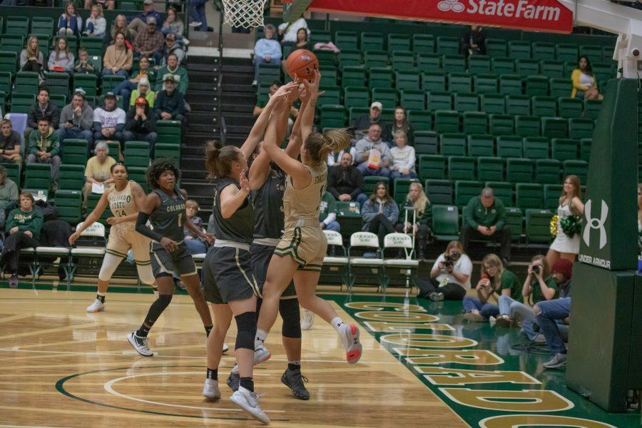 Katia Stamatelopoulos (1) drives around defenders and shoots from under the basket, as the University takes on Colorado University at Moby Arena, on Nov. 22. CSU falls 79-75. (Devin Cornelius | Collegian)