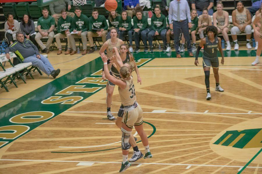 Andrea Brady (22) shoots from the three point line, during the University's home game against Colorado University on Nov. 22. CSU falls 79-75. (Devin Cornelius | Collegian)