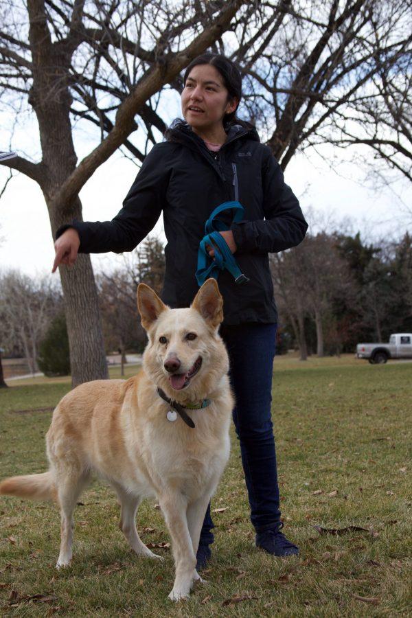 Melody Zarria with her dog in City Park on Nov. 16. Zarria noted that the park was a great place to relax and take the dog. (Ryan Schmidt | The Collegian)
