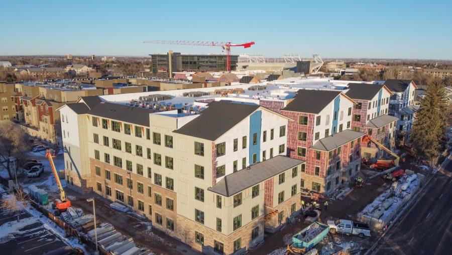 An aerial view of The Standard apartment with Canvas Stadium in the background. I will include 
a rooftop pool, and club house. (Devin Cornelius | Collegian)