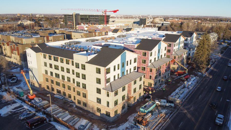 An aerial view of The Standard apartment with Canvas Stadium in the background. (Devin Cornelius | Collegian)