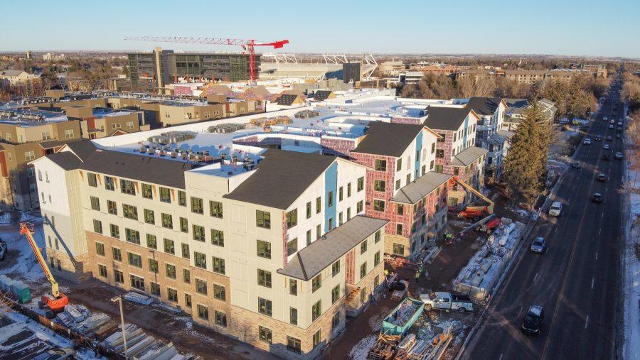 An aerial view of The Standard apartment with Canvas Stadium in the background. (Devin Cornelius | Collegian)