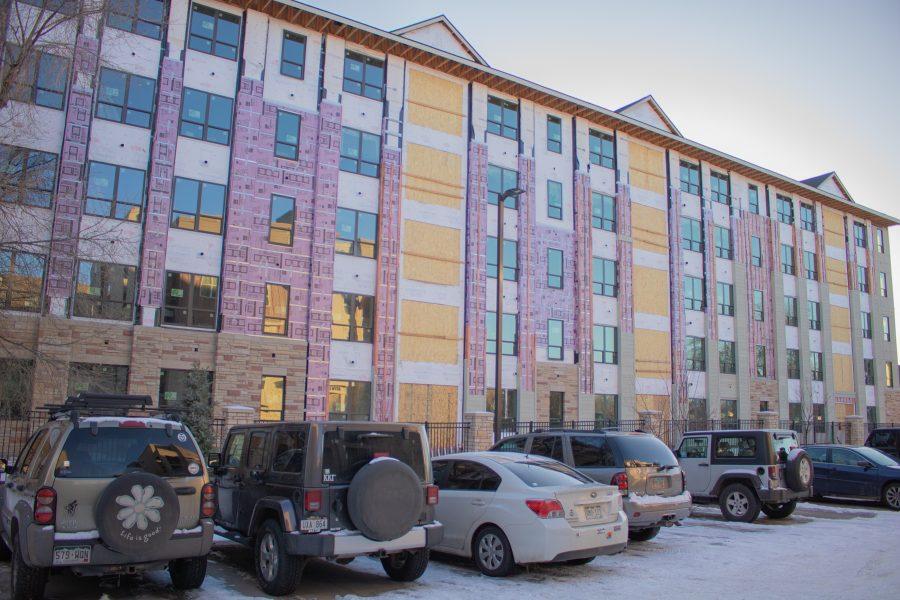 Parked cars sit in front of one of The Standard's buildings while it is under construction. (Devin Cornelius | Collegian)