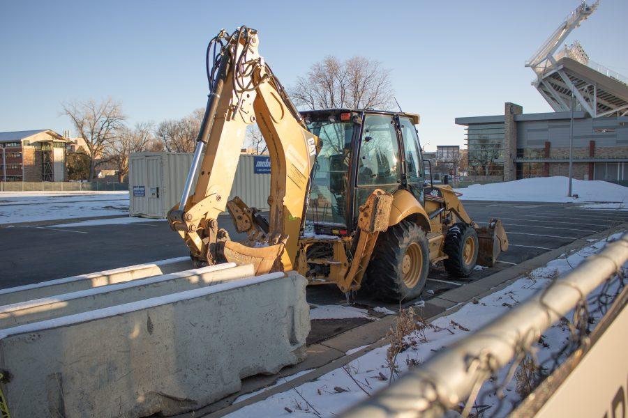 A Backhoe sits on the future lot of Meridian Village, a new housing community on campus which is scheduled to be completed in 2025. (Devin Cornelius | Collegian)