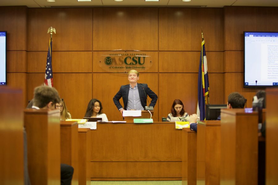 Speaker of the Senate Blake Alfred stands before the Associated Students of Colorado State University Senate body during roll call on Dec 11. The Senate heard a presentation from Vice President for Student Affairs Dr. Blanche Hughes, elected a new parliamentarian, and voted on legislation regarding support of the Hong Kong freedom fighters as well as the “Giants” Project. (Ryan Schmidt | The Collegian) 