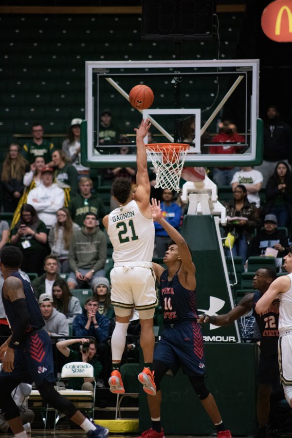 David Roddy (21) make a jump shot over a defender, during the Colorado State home game vs Fresno State. CSU wins 86-68. (Devin Cornelius | Collegian)