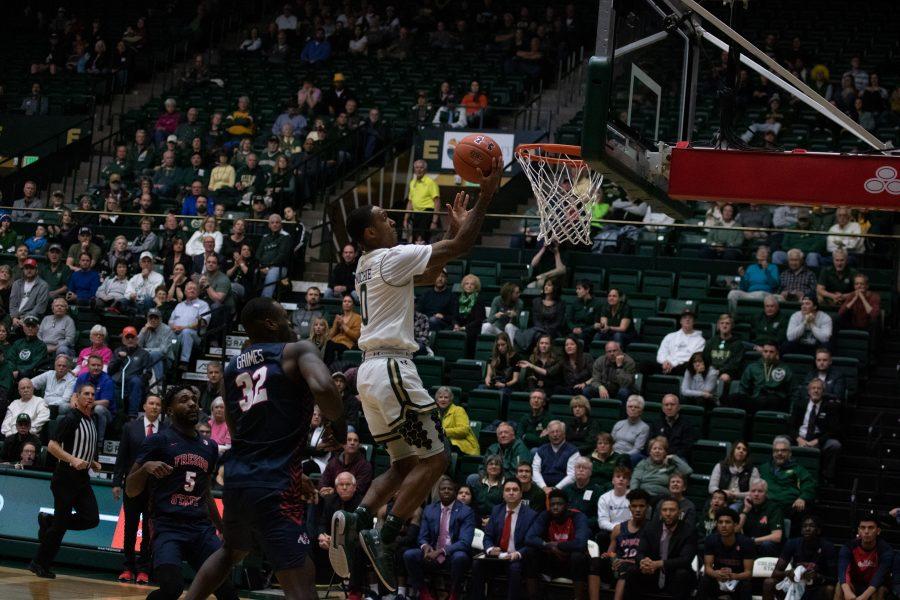 Hyron Edwards (0) makes a leaping layup with a defender behind him, during the Colorado State game against Fresno State. CSU wins 86-68. (Devin Cornelius | Collegian)