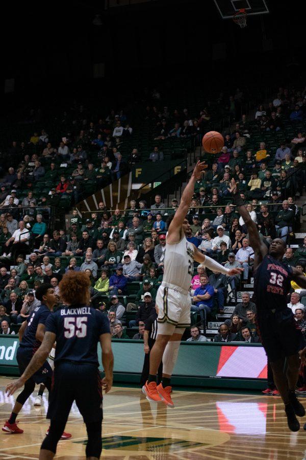 David Roddy (21) makes a jump shot over a defender, during the Colorado State home game vs Fresno State. CSU wins 86-68. (Devin Cornelius | Collegian)