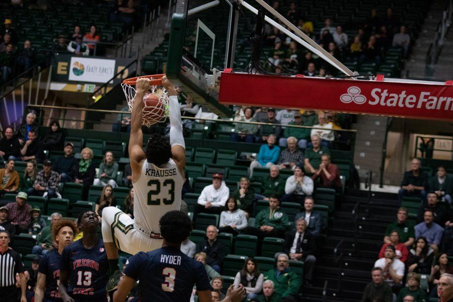 John Tonje (23) dunks the ball as defenders watch, during the Colorado State home game against Fresno State. CSU wins 86-68. (Devin Cornelius | Collegian)